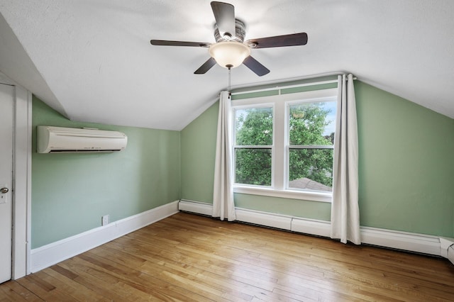 1829 Ross Ave E, Saint Paul, MN 55119 - bonus room with a wall mounted air conditioner, hardwood / wood-style flooring, vaulted ceiling, a ceiling fan, and baseboards