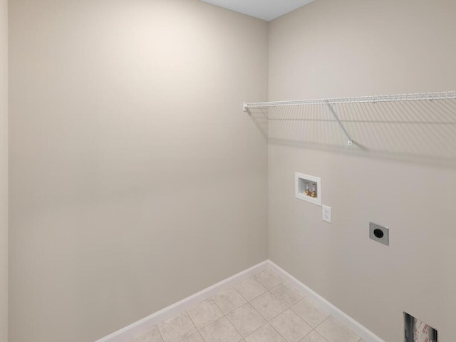 3218 Kady Ave NE, Saint Michael, MN 55376 - laundry area with electric dryer hookup, hookup for a washing machine, baseboards, and light tile patterned floors
