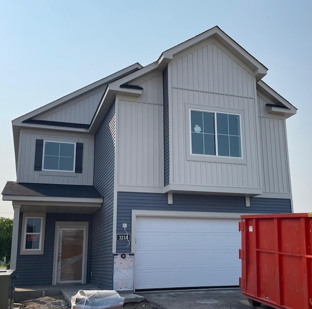 3218 Kady Ave NE, Saint Michael, MN 55376 - view of front facade with an attached garage, board and batten siding, and driveway