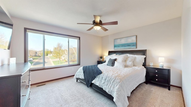 2762 134th St W, Rosemount, MN 55068 - bedroom with light colored carpet, baseboards, and a ceiling fan