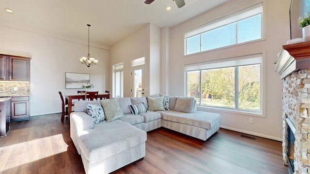 2762 134th St W, Rosemount, MN 55068 - living area with healthy amount of natural light, ceiling fan, a towering ceiling, dark wood finished floors, and a chandelier