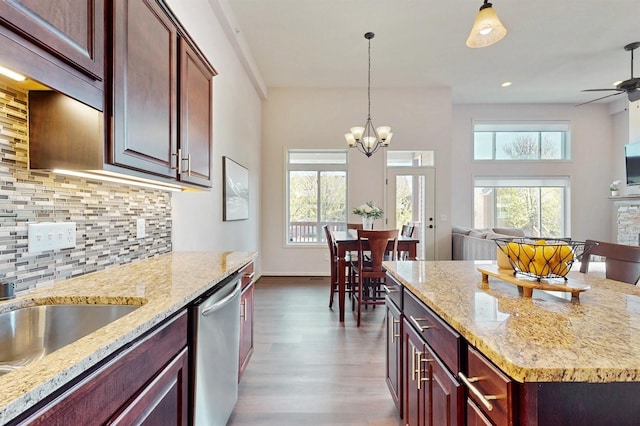 2762 134th St W, Rosemount, MN 55068 - kitchen featuring dishwasher, plenty of natural light, wood finished floors, open floor plan, and recessed lighting