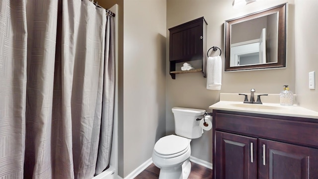 2762 134th St W, Rosemount, MN 55068 - bathroom with toilet, vanity, baseboards, and a shower with shower curtain