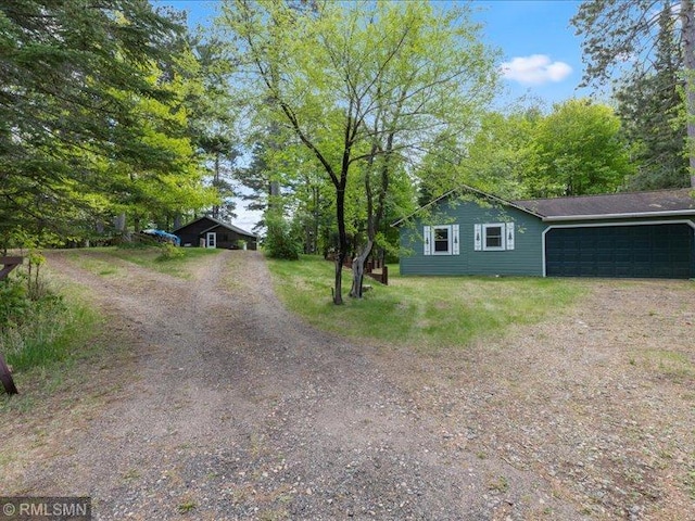 1403 County 5 NW, Hackensack, MN 56452 - view of side of property featuring dirt driveway and a garage
