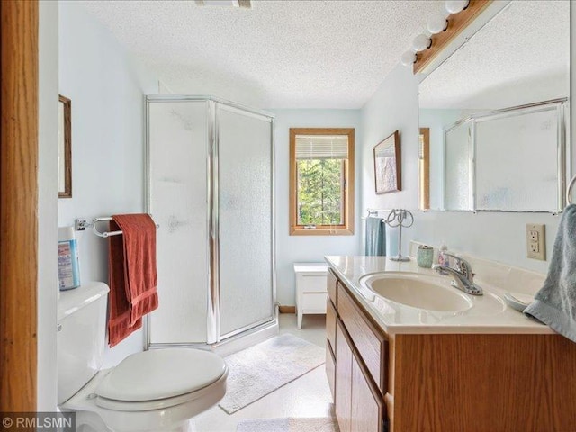 1403 County 5 NW, Hackensack, MN 56452 - bathroom featuring a shower stall, vanity, toilet, and a textured ceiling