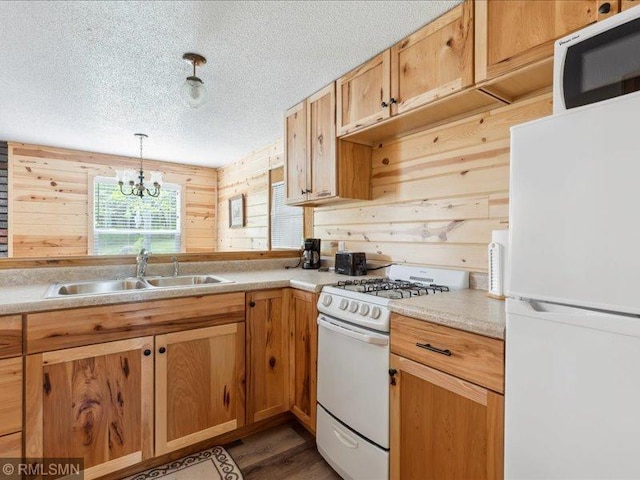 1403 County 5 NW, Hackensack, MN 56452 - kitchen with white appliances, a sink, a textured ceiling, a chandelier, and light countertops