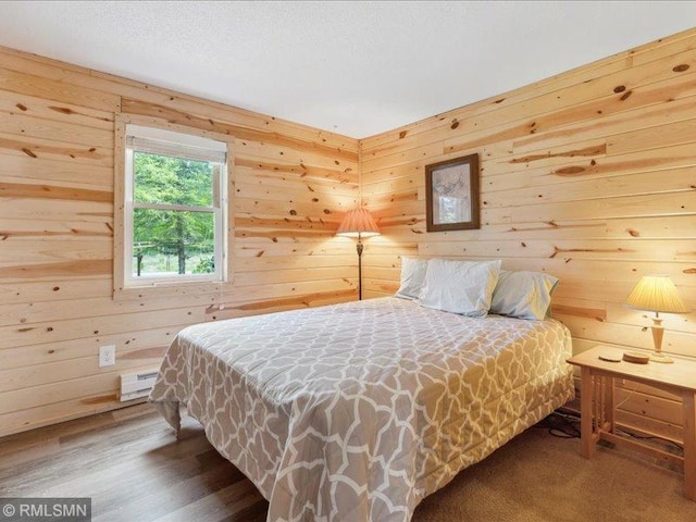 1403 County 5 NW, Hackensack, MN 56452 - bedroom with wooden walls and wood finished floors