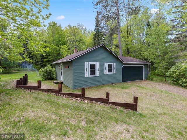 1403 County 5 NW, Hackensack, MN 56452 - view of side of property with a yard and a chimney