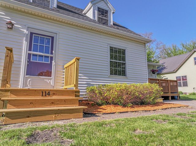 114 Iowa Ave, Hoffman, MN 56339 - view of exterior entry with roof with shingles and a deck