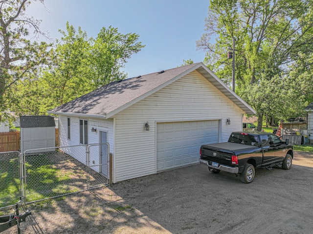 114 Iowa Ave, Hoffman, MN 56339 - detached garage featuring a gate and a storage unit