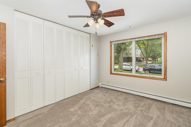 6415 York Ave S Unit 105, Edina, MN 55435 - unfurnished bedroom featuring baseboard heating, carpet flooring, a closet, ceiling fan, and baseboards