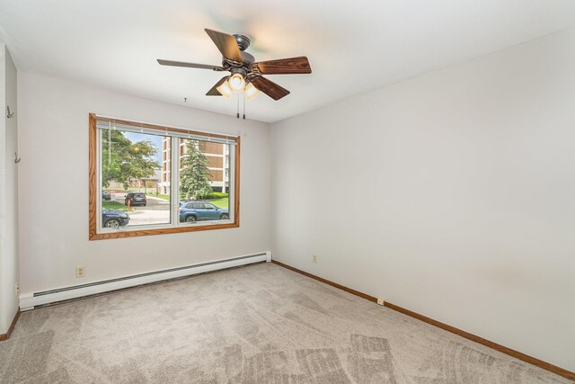 6415 York Ave S Unit 105, Edina, MN 55435 - spare room featuring baseboard heating, carpet floors, a ceiling fan, and baseboards