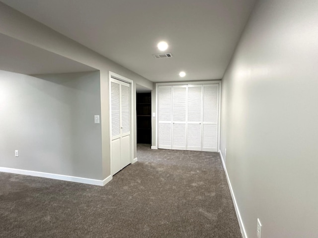 corridor with carpet floors, baseboards, and recessed lighting