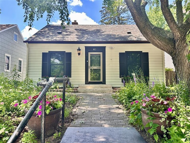 40 Penn Ave S, Minneapolis, MN 55405 - bungalow-style home with a chimney and a shingled roof
