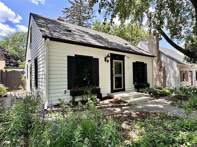 40 Penn Ave S, Minneapolis, MN 55405 - view of front facade featuring a chimney