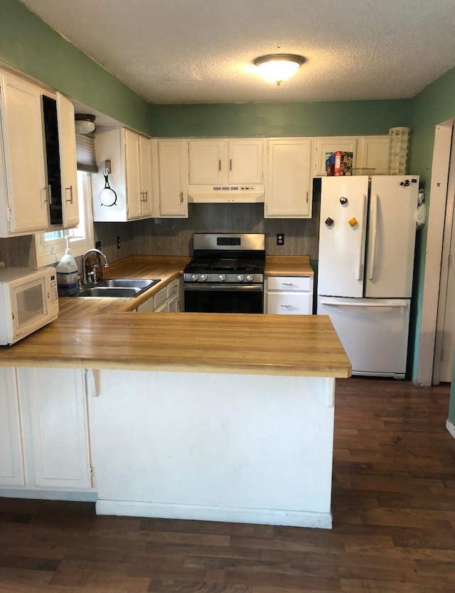 10989 Osage St NW, Coon Rapids, MN 55433 - kitchen with white appliances, a sink, under cabinet range hood, a peninsula, and butcher block countertops