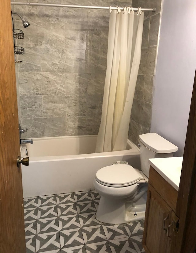 10989 Osage St NW, Coon Rapids, MN 55433 - bathroom with shower / tub combo with curtain, tile patterned floors, toilet, and vanity