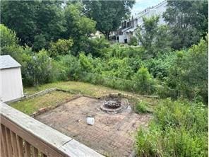 10989 Osage St NW, Coon Rapids, MN 55433 - view of yard with an outdoor fire pit and an outdoor structure