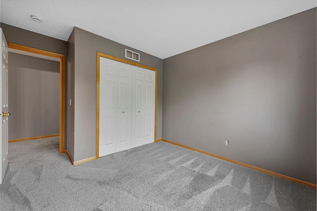 13037 Europa Trail Way N Unit A, Hugo, MN 55038 - unfurnished bedroom featuring carpet, baseboards, and a closet