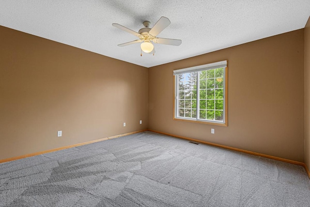 13037 Europa Trail Way N Unit A, Hugo, MN 55038 - carpeted empty room with ceiling fan, baseboards, and a textured ceiling