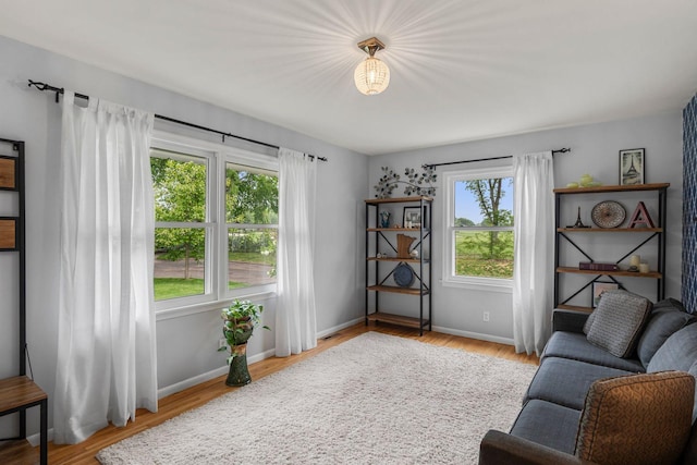 2401 Decatur Ave S, Saint Louis Park, MN 55426 - sitting room featuring healthy amount of natural light, wood finished floors, and baseboards