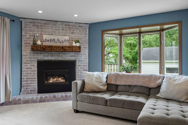2401 Decatur Ave S, Saint Louis Park, MN 55426 - carpeted living area featuring healthy amount of natural light, a fireplace, and recessed lighting