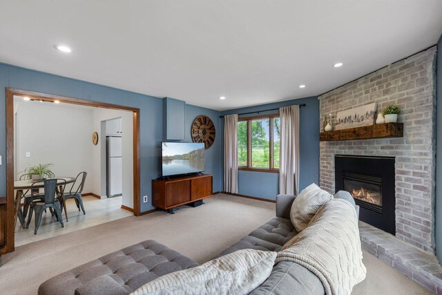 2401 Decatur Ave S, Saint Louis Park, MN 55426 - living room with light colored carpet, a fireplace, baseboards, and recessed lighting
