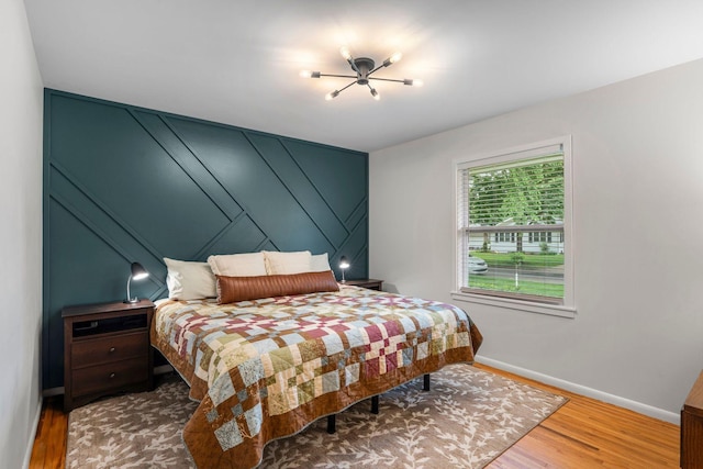 2401 Decatur Ave S, Saint Louis Park, MN 55426 - bedroom with baseboards and wood finished floors