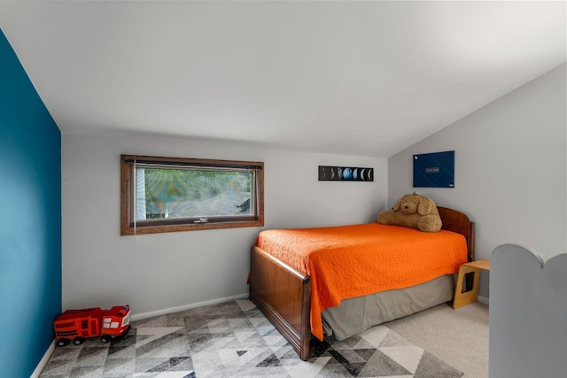 2401 Decatur Ave S, Saint Louis Park, MN 55426 - carpeted bedroom featuring vaulted ceiling and baseboards