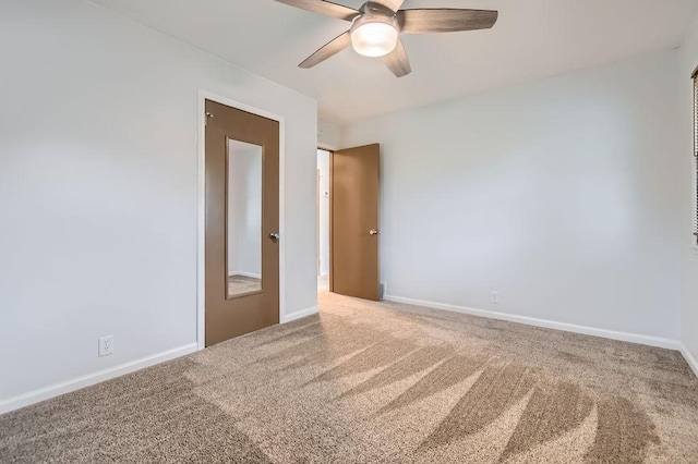 11131 Magnolia St NW, Coon Rapids, MN 55448 - carpeted spare room featuring ceiling fan and baseboards
