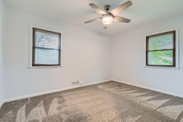 11131 Magnolia St NW, Coon Rapids, MN 55448 - carpeted empty room with baseboards and ceiling fan