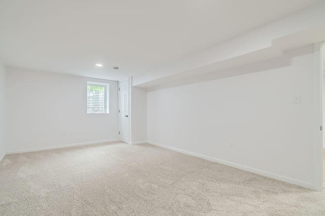 11131 Magnolia St NW, Coon Rapids, MN 55448 - spare room with light colored carpet, baseboards, and recessed lighting