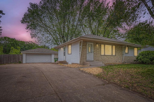 11131 Magnolia St NW, Coon Rapids, MN 55448 - view of front of home featuring an outdoor structure, a detached garage, and stone siding