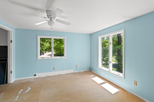 13144 Maple Circle Dr SE, Hudson Twp, MN 56334 - unfurnished room with baseboards and ceiling fan