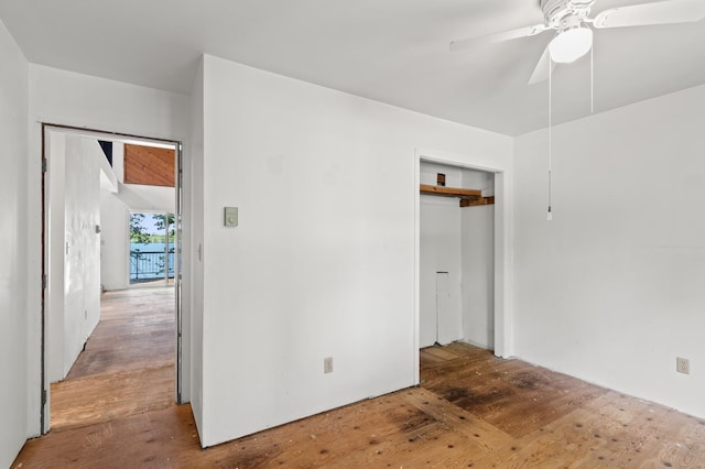 13144 Maple Circle Dr SE, Hudson Twp, MN 56334 - unfurnished bedroom with wood finished floors, a closet, and a ceiling fan