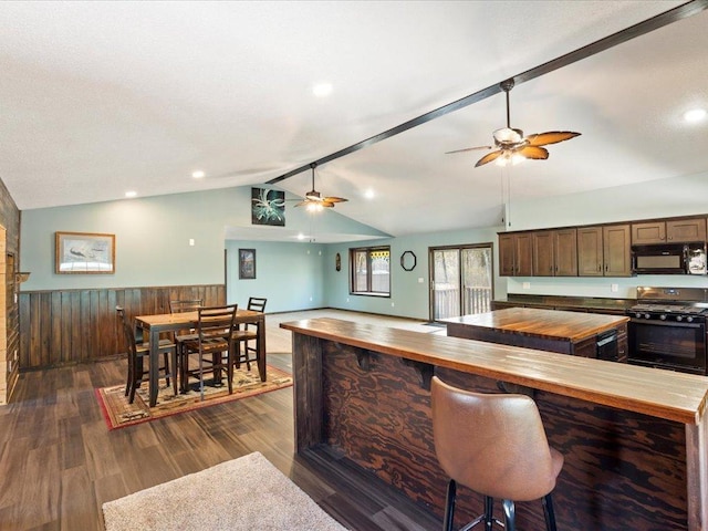 1465 State 84 NW, Backus, MN 56435 - kitchen with gas range, black microwave, wooden counters, a ceiling fan, and wainscoting