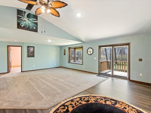 1465 State 84 NW, Backus, MN 56435 - unfurnished living room featuring baseboards, wood finished floors, lofted ceiling, a ceiling fan, and recessed lighting
