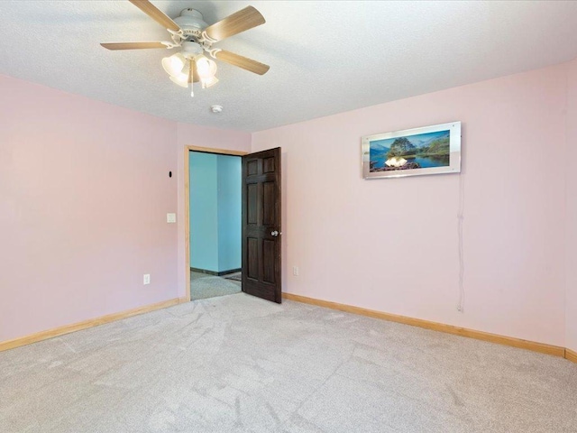 1465 State 84 NW, Backus, MN 56435 - carpeted empty room featuring baseboards, a ceiling fan, and a textured ceiling