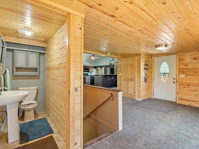 1465 State 84 NW, Backus, MN 56435 - bathroom featuring wood ceiling, wood walls, toilet, and a sink