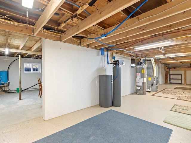 1465 State 84 NW, Backus, MN 56435 - unfinished basement with gas water heater, heating unit, a water softener system, and a water pressure tank