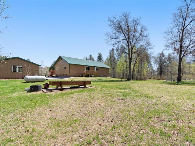 1465 State 84 NW, Backus, MN 56435 - view of grassy yard with a deck