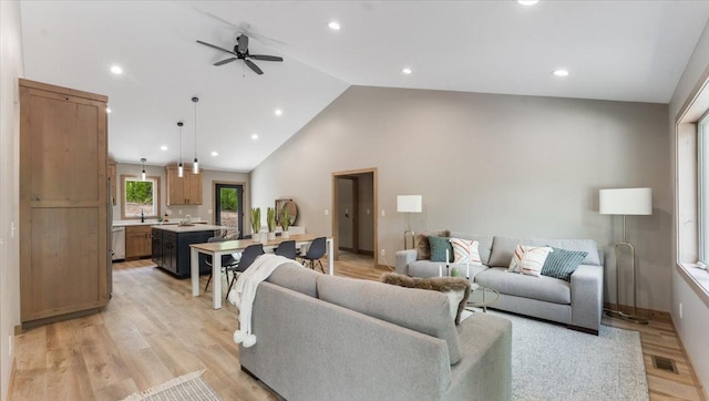 2948 N Oaks Ln NW, Garfield, MN 56332 - living room with a ceiling fan, high vaulted ceiling, recessed lighting, light wood-style flooring, and baseboards