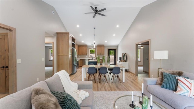 2948 N Oaks Ln NW, Garfield, MN 56332 - living area with high vaulted ceiling, a ceiling fan, light wood-style floors, recessed lighting, and baseboards