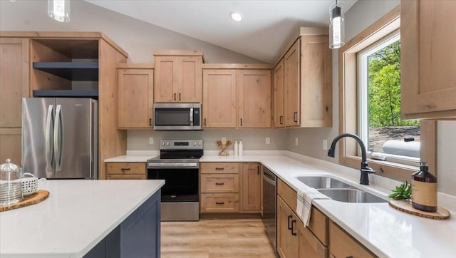 2948 N Oaks Ln NW, Garfield, MN 56332 - kitchen featuring stainless steel appliances, a sink, light countertops, light brown cabinets, and lofted ceiling
