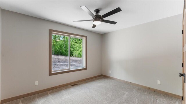 2948 N Oaks Ln NW, Garfield, MN 56332 - carpeted empty room featuring baseboards and ceiling fan