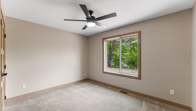 2948 N Oaks Ln NW, Garfield, MN 56332 - unfurnished room featuring baseboards, light colored carpet, and ceiling fan