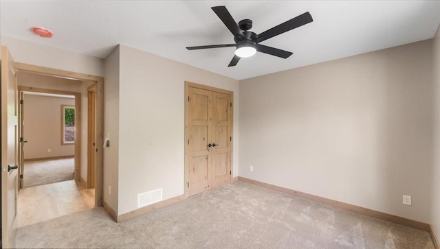 2948 N Oaks Ln NW, Garfield, MN 56332 - unfurnished bedroom with carpet floors, baseboards, and a ceiling fan
