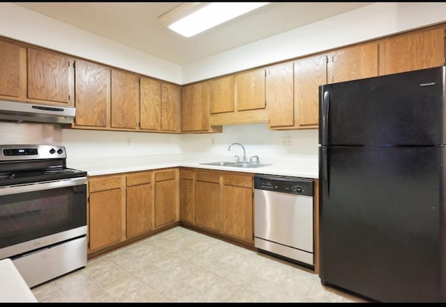 221 Grand Ave W Unit 314, South Saint Paul, MN 55075 - kitchen featuring stainless steel appliances, under cabinet range hood, a sink, light countertops, and brown cabinets