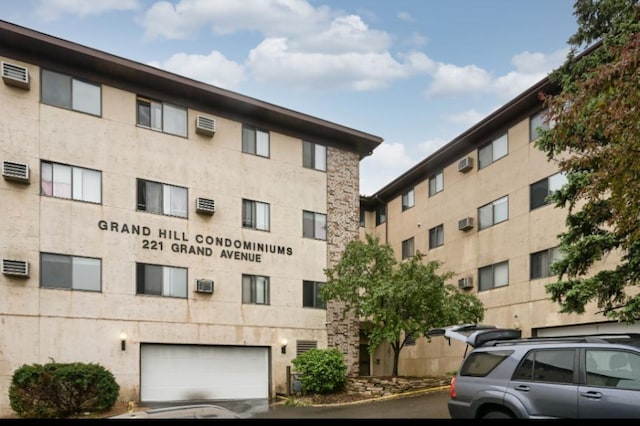 221 Grand Ave W Unit 314, South Saint Paul, MN 55075 - view of apartment building / complex with an attached garage