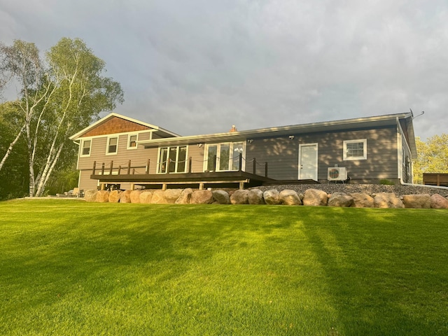 11946 180th St, Milaca Twp, MN 56353 - rear view of property with a deck, a lawn, and ac unit